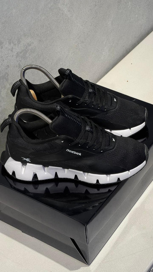 REBOOK SIG NEGRO BLANCO PROMO